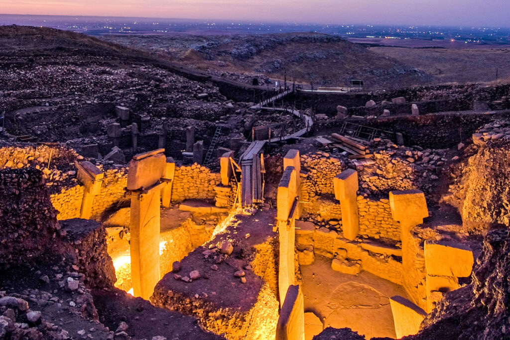 Archaeologists examining the archaeological significance of Göbeklitepe’s ancient structures.