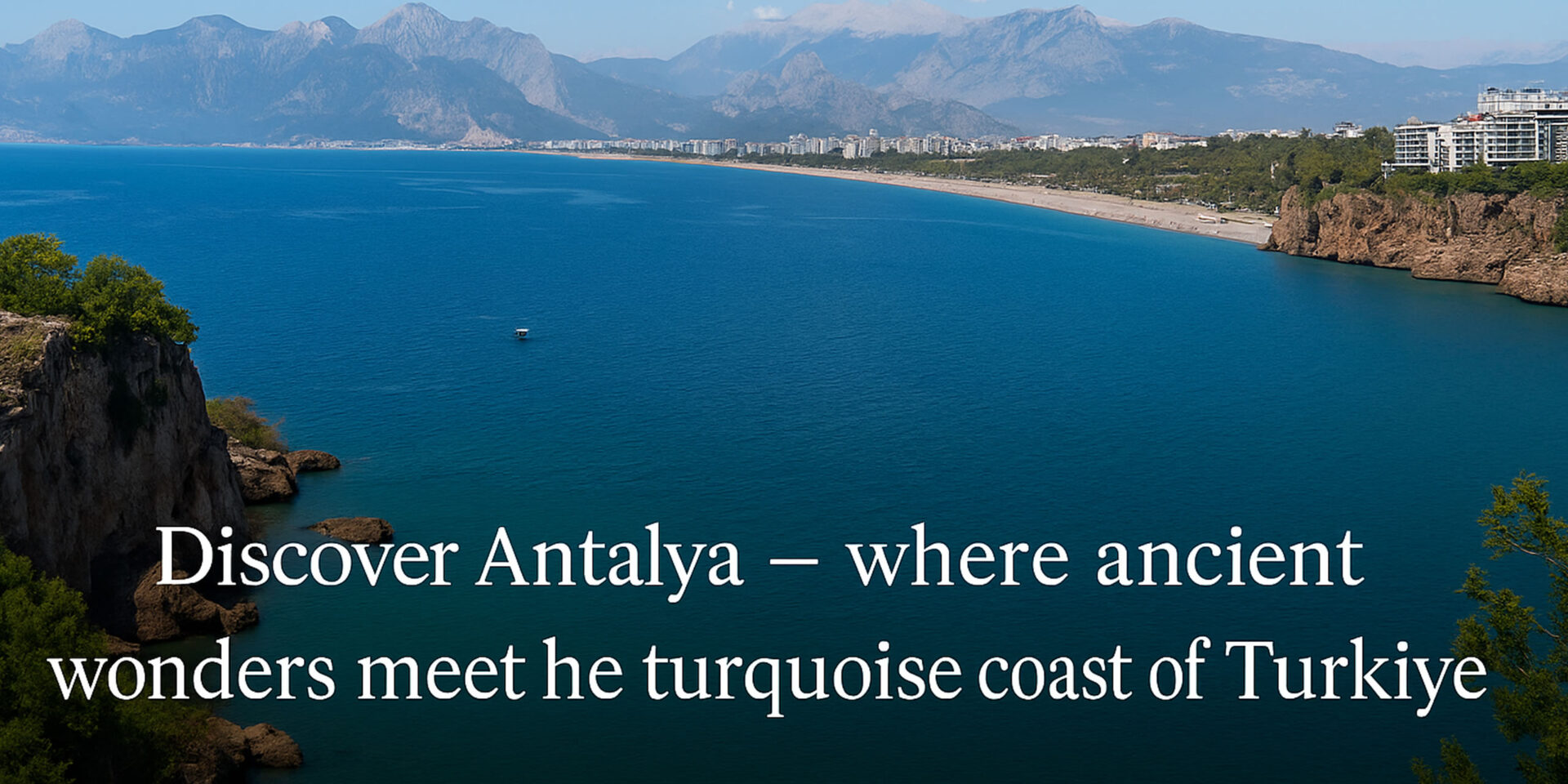A stunning panoramic view of Antalya’s coastline with turquoise waters, beaches, and the Taurus Mountains in the background.