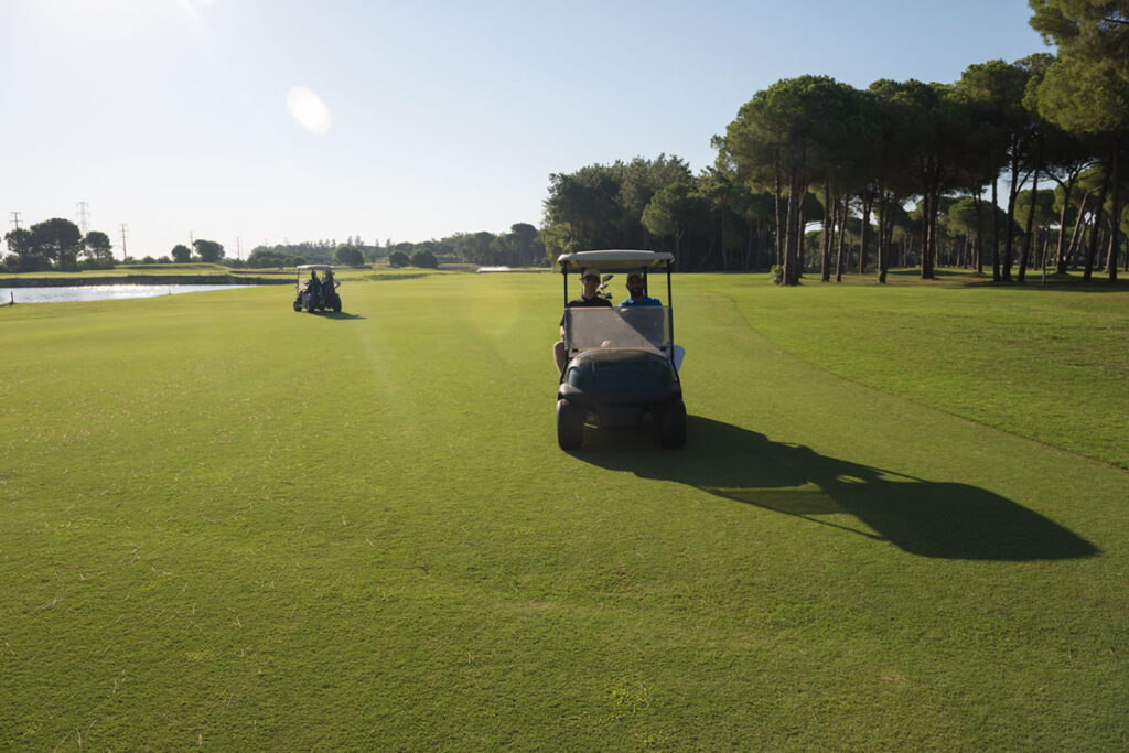 Golfers on a lush course beside a luxury resort in Belek, Antalya.