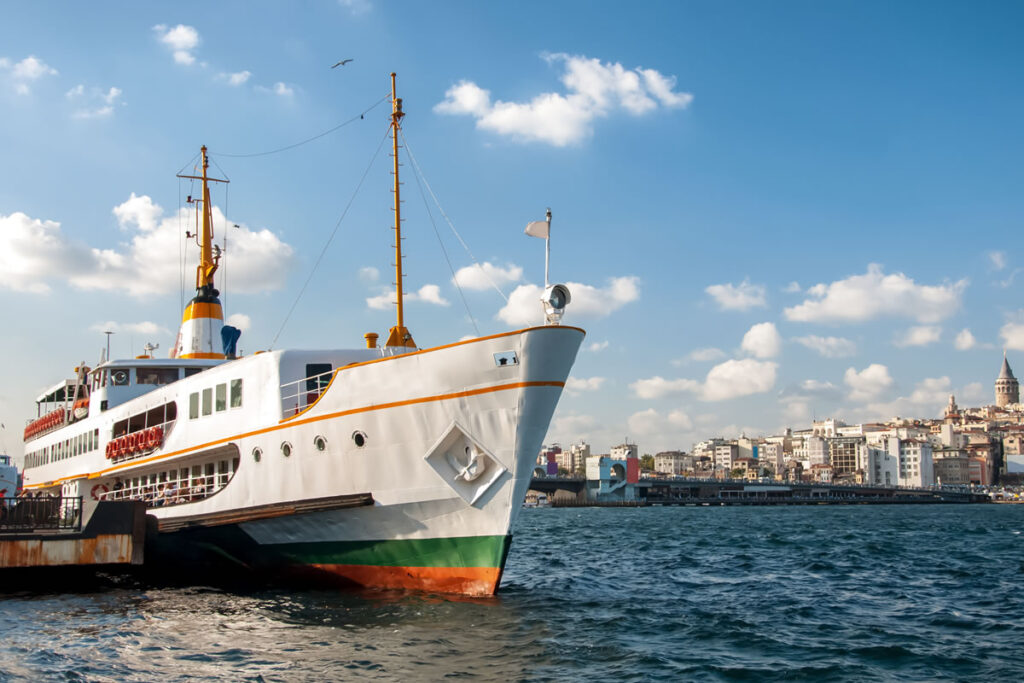 Ferry arriving at Kadıköy pier with the Moda coastline in the background